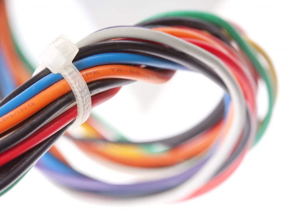 Electrical cables with heat shrink tubing wrapped with a zip tie
